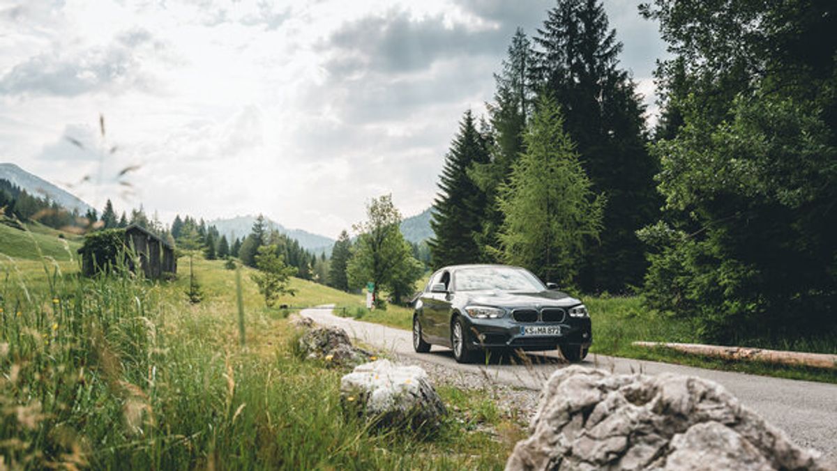 car driving through european countryside